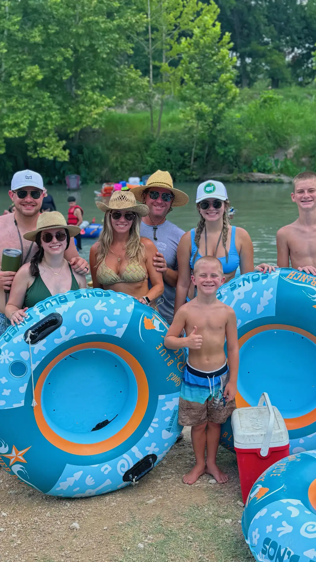 Family tubing together on the San Marcos River