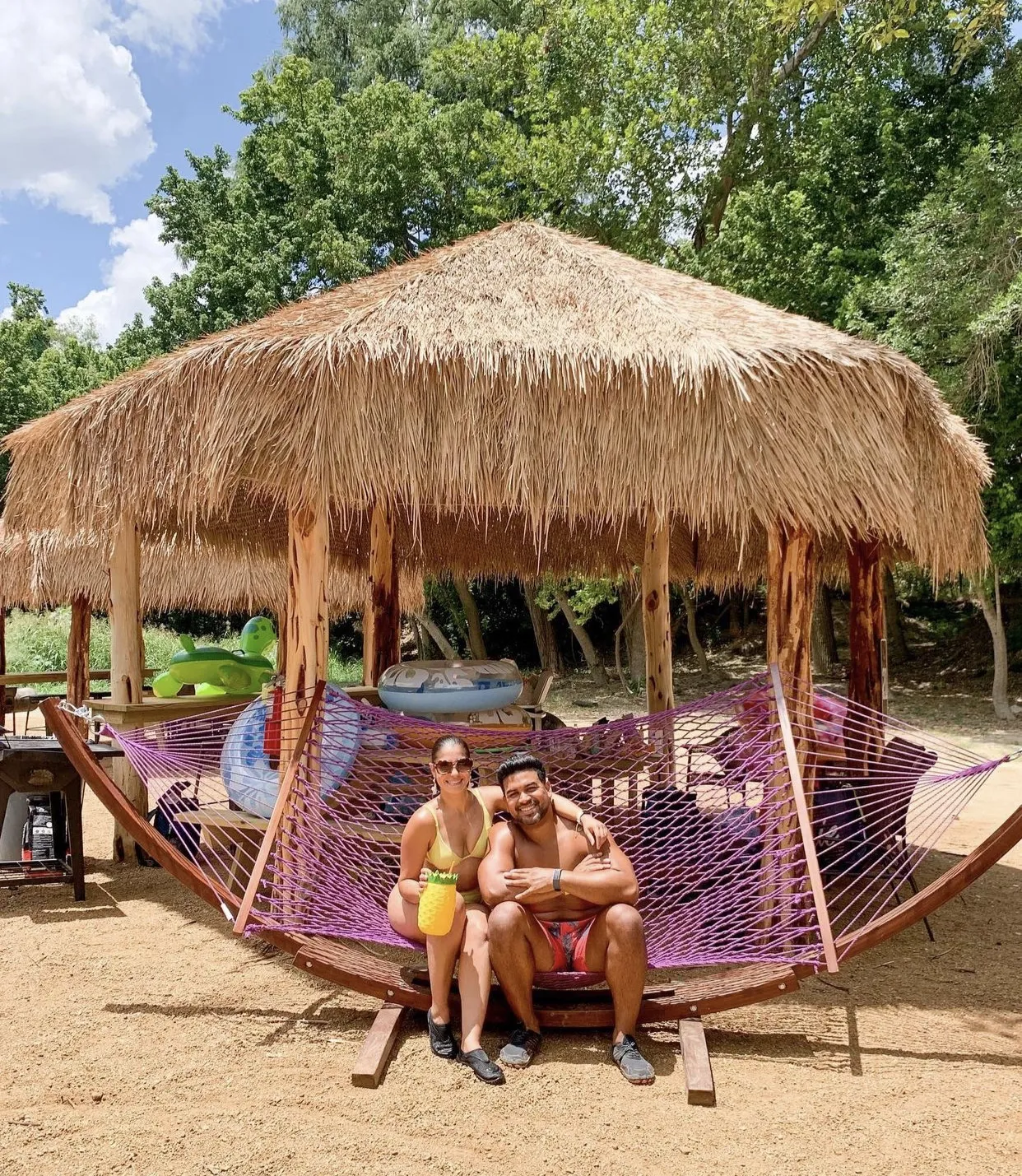 Couple in hammock at waterfront cabin rental near San Antonio
