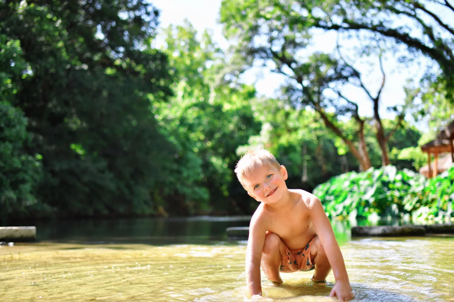 Family enjoying riverside picnic