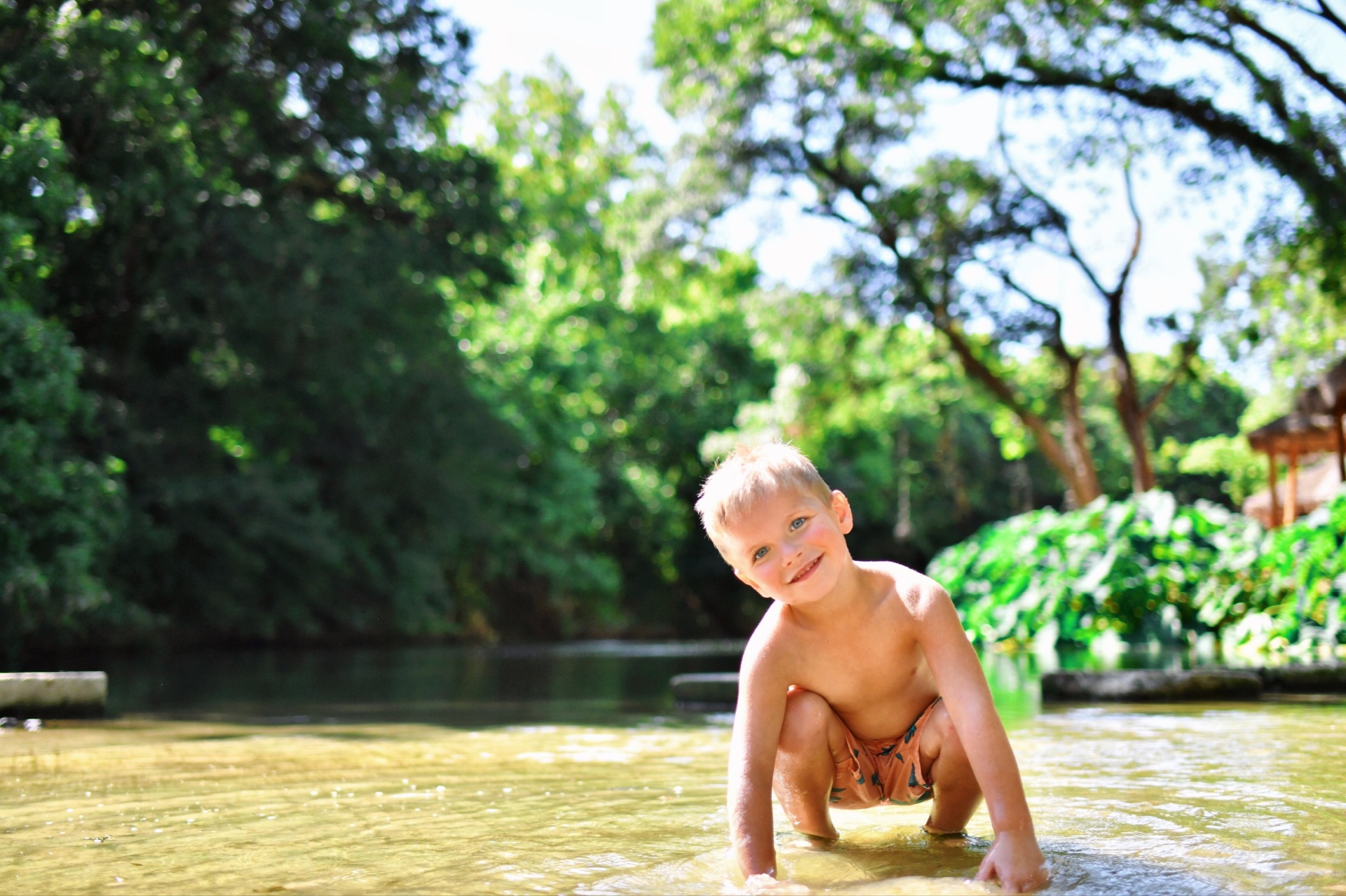 Family enjoying riverside picnic