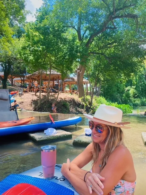 Kids playing in the river with tubes