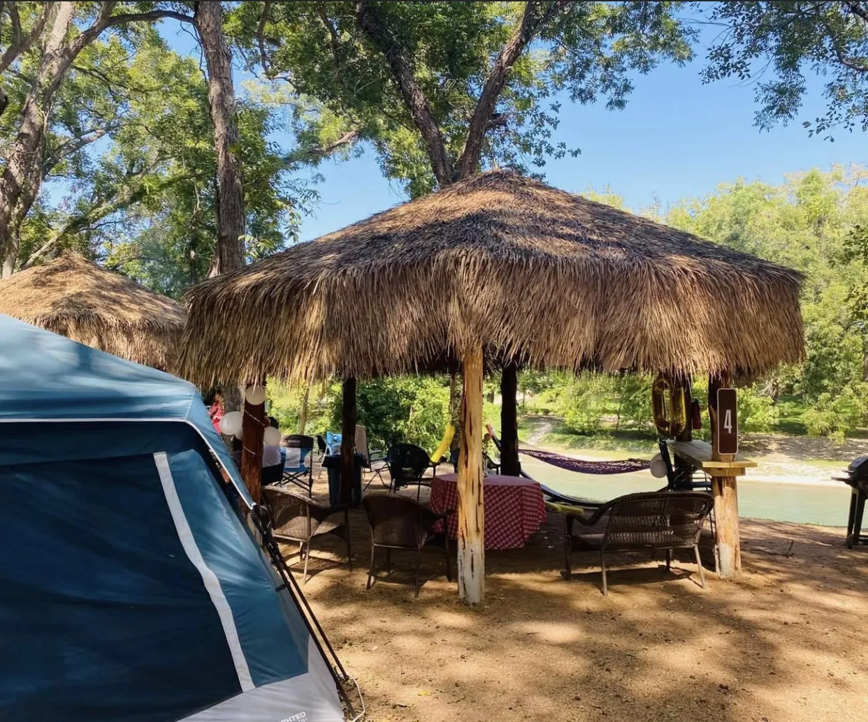 Tiki cabana by the creek — spring break family activities near San Antonio