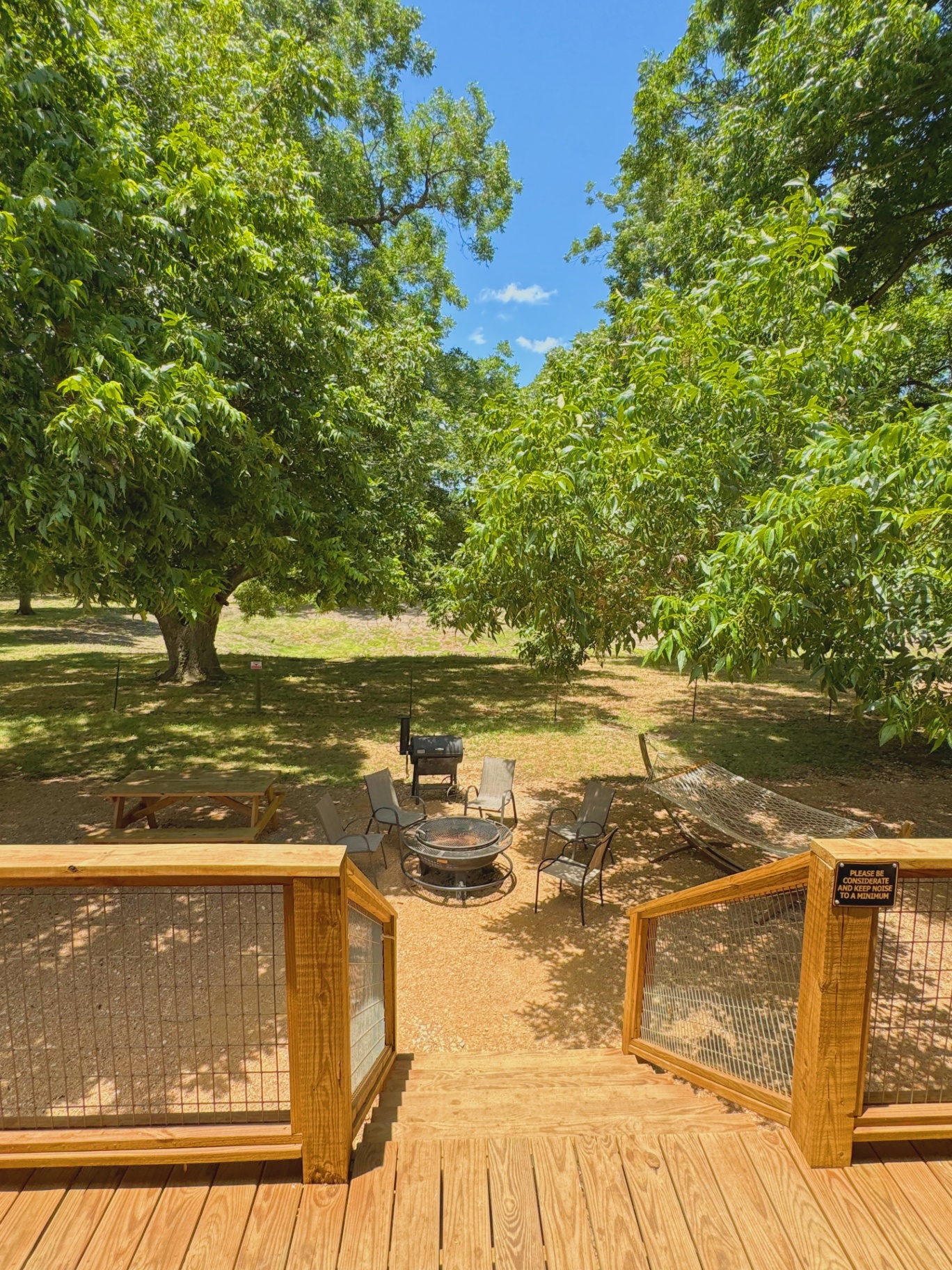 Safari Cabin deck with firepit and seating