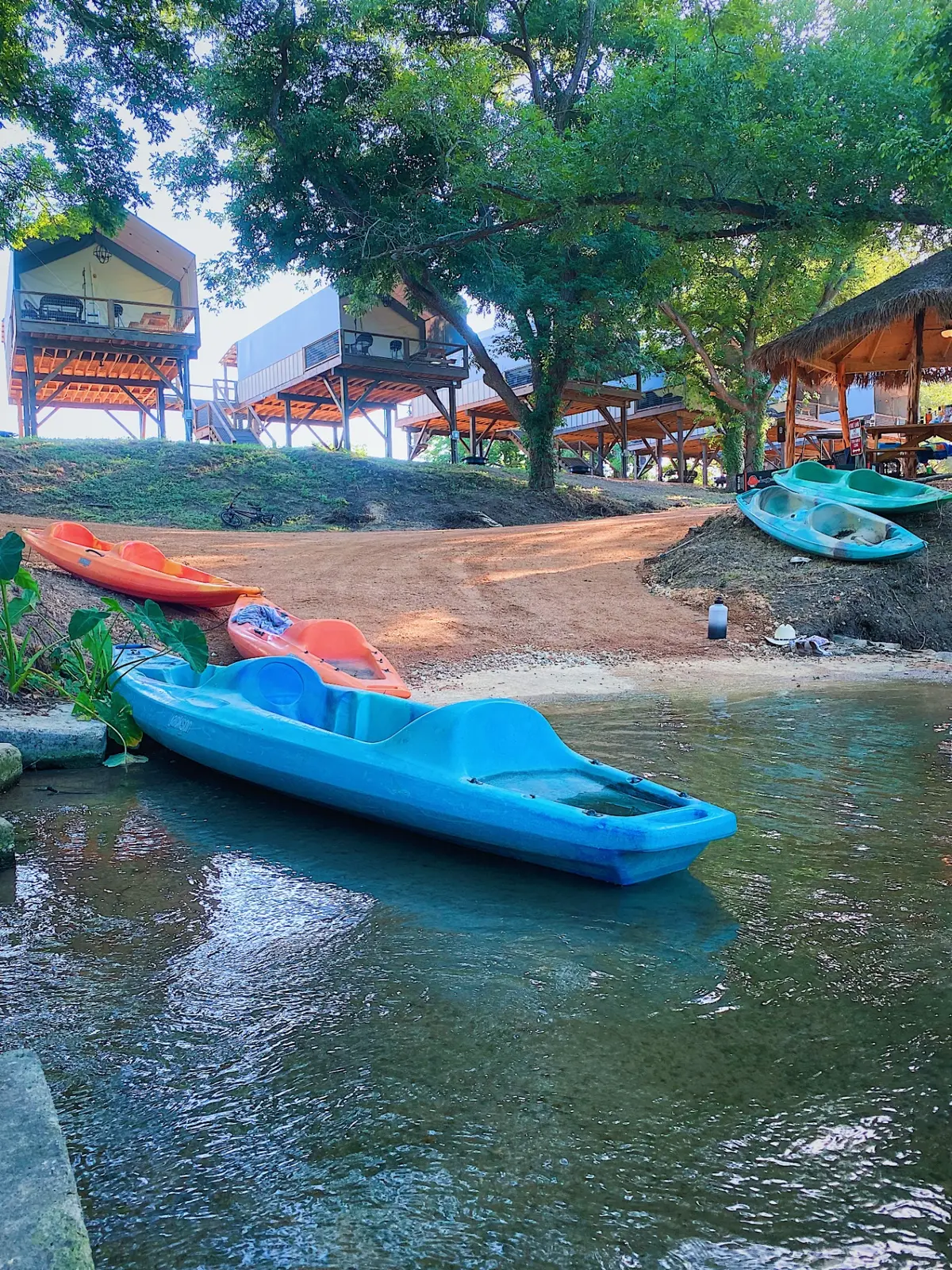 Colorful kayaks lined up near San Antonio at Cibolo Creek