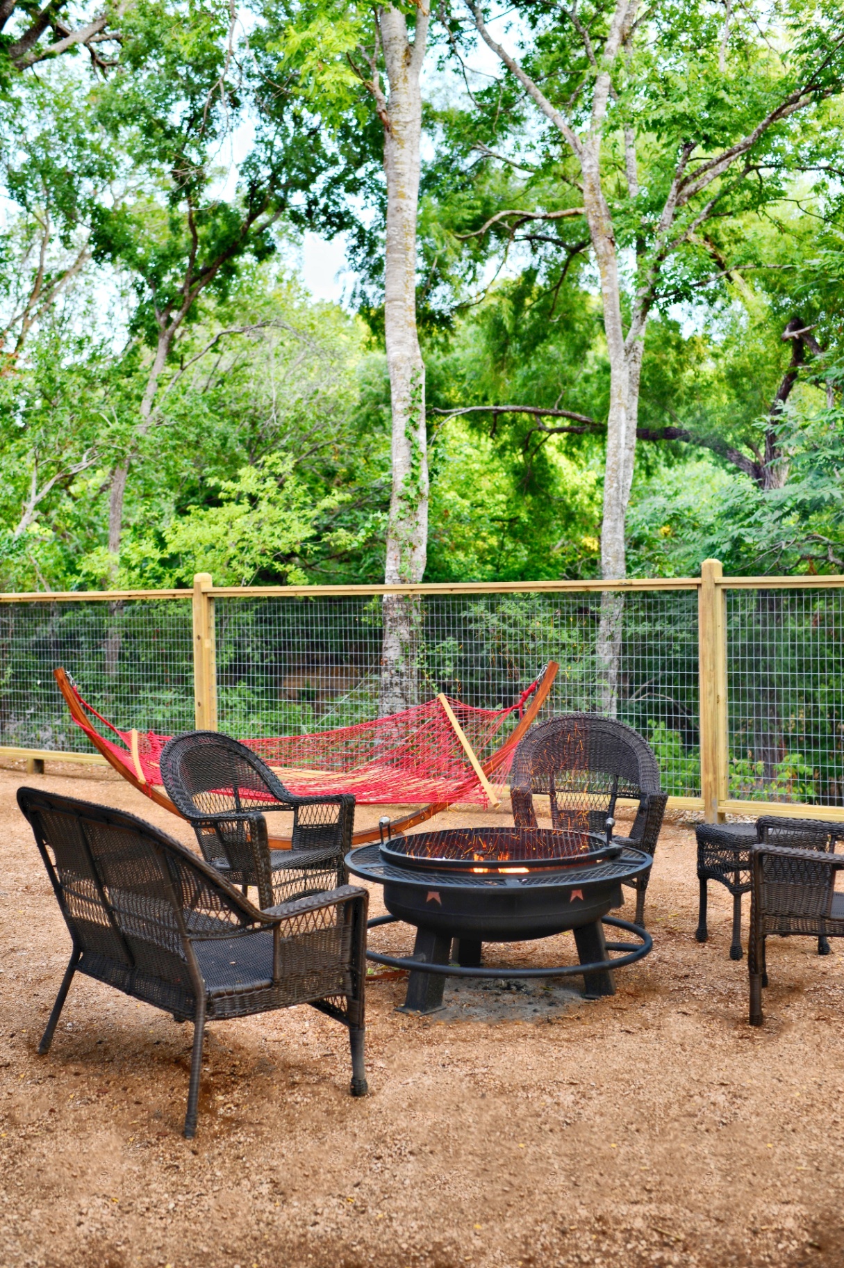Fire pit area with hammock and seating