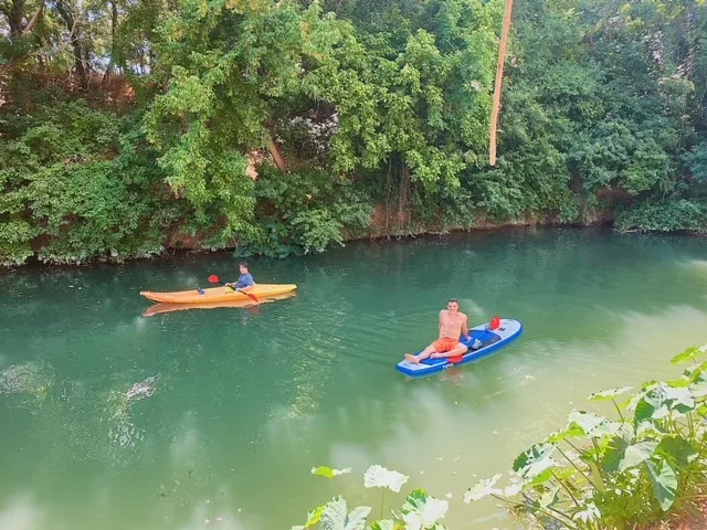Relaxing on paddleboard in creek