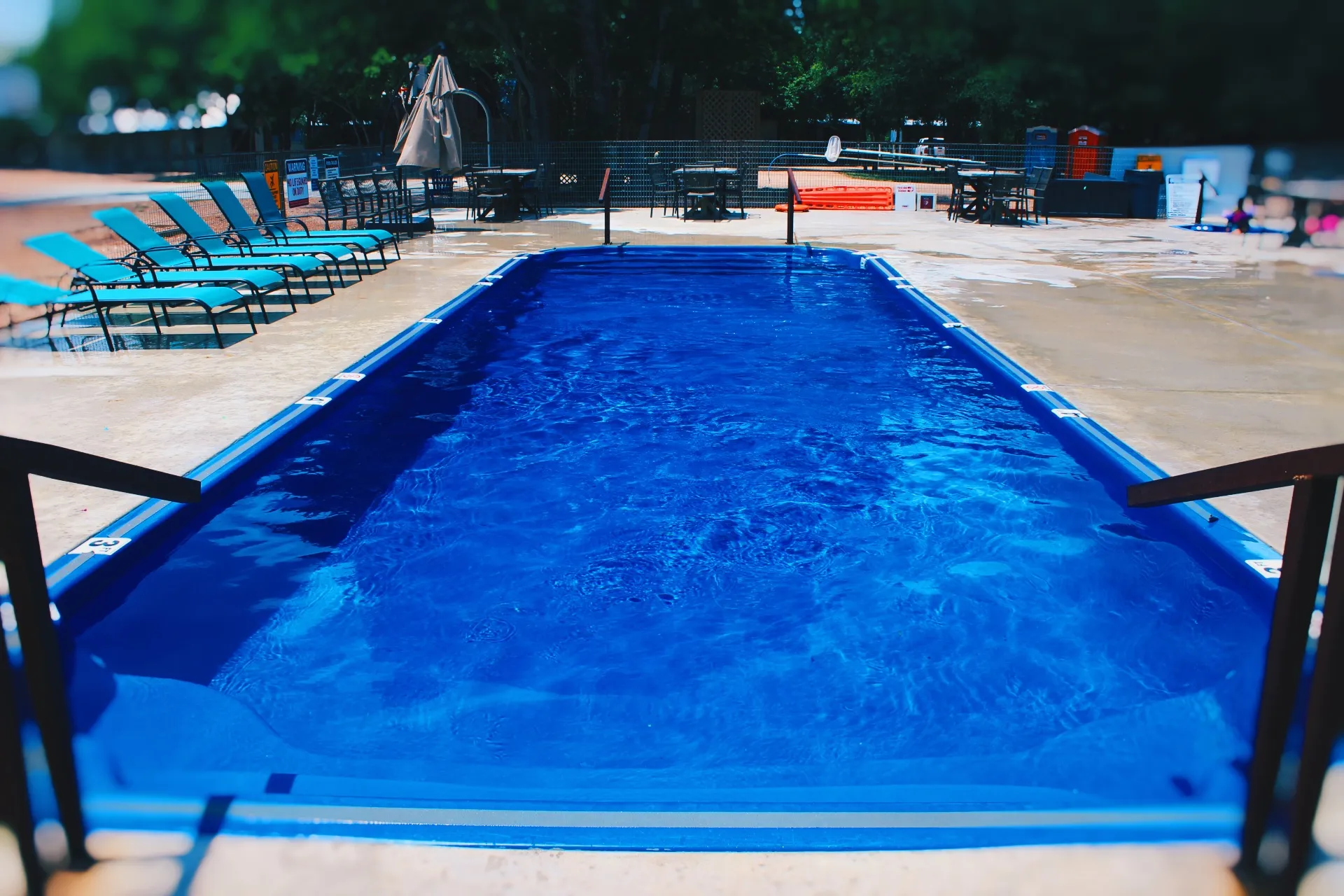 Evening pool scene with volleyball net